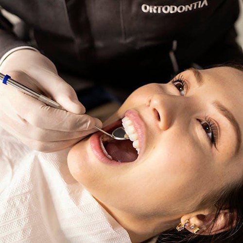 Dentist examining woman’s mouth