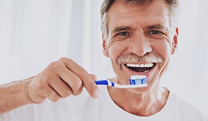 Man holding a toothbrush