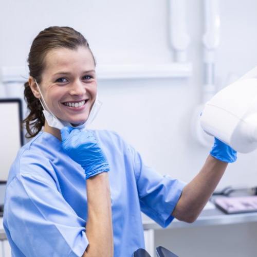 Dental receptionist smiles