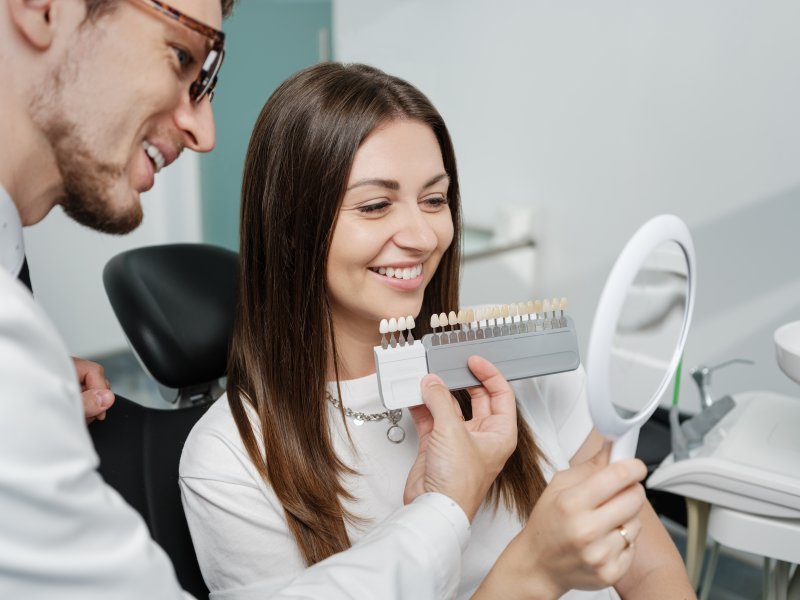 a patient smiling during the veneer process